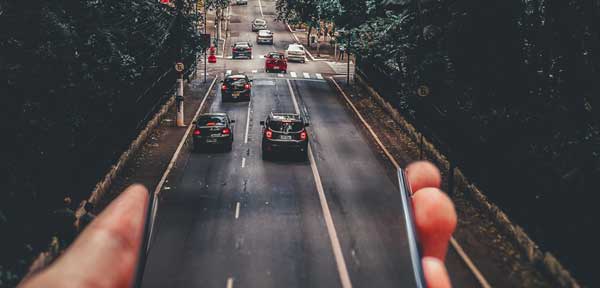 A hand holding a length of road