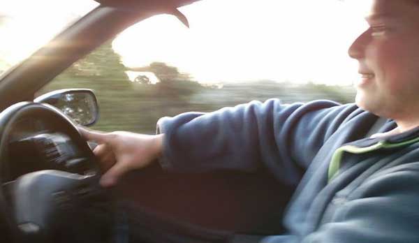 A relaxed, happy car driver