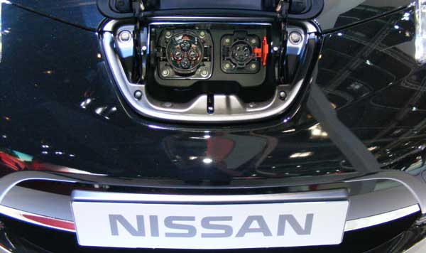 A Nissan Leaf plugged into an electric charge point