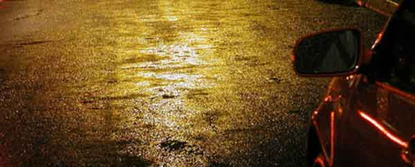 A car standing on a wet road