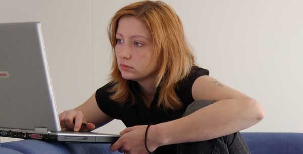 A woman choosing breakdown cover online